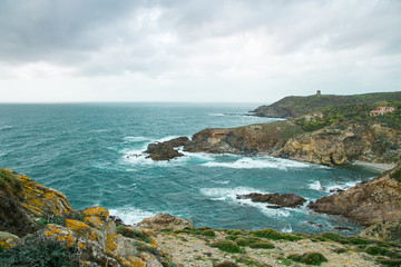 Large view on the sardinian coast with Torre dei Corsari in the background