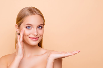 Pretty charming cute girl with perfect smooth soft skin holding copy space empty place on her palm...