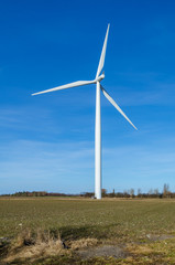 Fototapeta premium Wind turbine On A Field In Denmark With Blue Sky