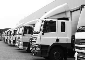 lorries parked up outside a company's car parking area ready to deliver goods to customers stock...