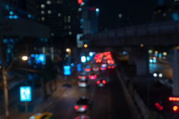 Fototapeta na wymiar Multicolored defocused bokeh blurry lights. Abstract blur defocus bokeh background of car light glowing or Illuminate at night as Citylife lifestyle Concept.