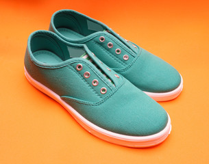 Green Sneakers on Orange