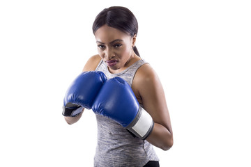 Black female on a white background wearing boxing gloves looking angry.  Part of image set for...
