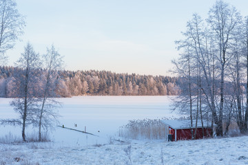 Small empty beach by the lake at winter