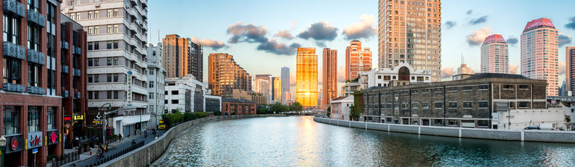 Shanghai, China. Wide view of Suzhou Creek with Jing'an districts on the left and Huangpu on the right. 
