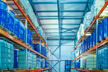 Metal barrels are on the shelves. Chemical industry. Chemical substances.