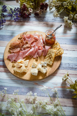 Closeup of tasty appetizers on wooden rustic background.
