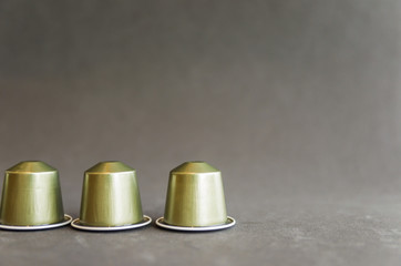 Beautiful colored coffee capsules on black background