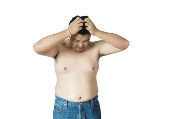 Fat man does not wear a shirt,overweight man trying on cloth ,on white backgroun, copy space