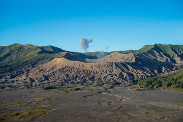 Beautiful view landscape of active volcano crater with fog and smoke at Bromo Tengger Semeru National Park, East Java, of Indonesia.