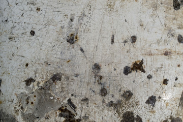 Old dirty metal coated with white paint
