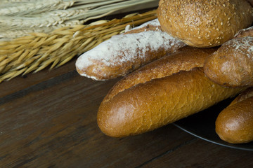 Bread  Wheat oats on wood  image background.