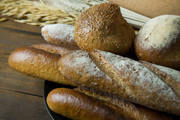 Bread  Wheat oats on wood  image background.