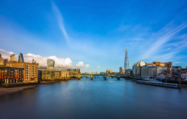Fototapeta na wymiar London, England - Panoramic skyline view of central London with skyscrapers of Bank district, River Thames, Tower Bridge and other famous landmarks at sunset