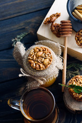 A fragrant flower tea with delicious cookies on the dark table