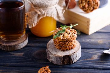 A fragrant flower tea with delicious cookies on the dark table