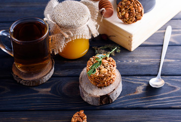 A fragrant flower tea with delicious cookies on the dark table