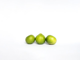 Green lemon on isolated white background.
