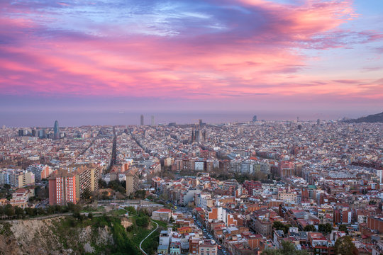 Beautiful panorama view of Barcelona city skyline and Sagrada familia at sunset time, Spain