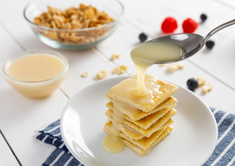 crackers with condensed milk and fruit, breakfast