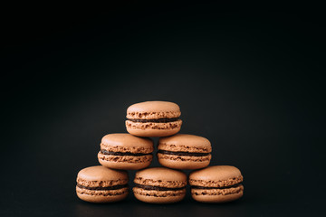 Close up of macaroons isolated on black background