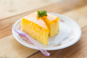 Orange cake on wooden table background