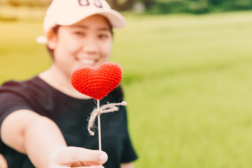 Cute fat girl teen giving heart love concept with space for text