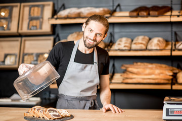 Bread seller working at the bakery shop