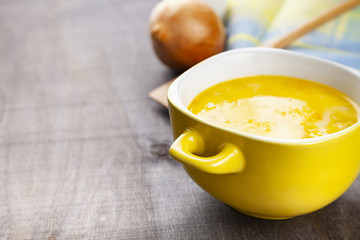 Cheese soup in a yellow plate