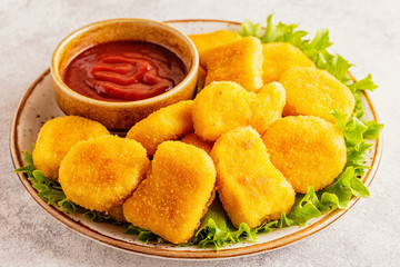 Chicken breast nuggets with sauces.