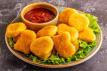 Chicken breast nuggets with sauces.