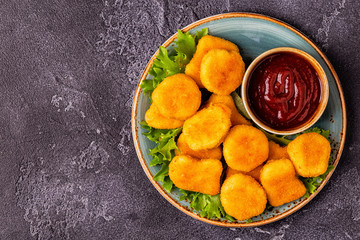 Chicken breast nuggets with sauces.