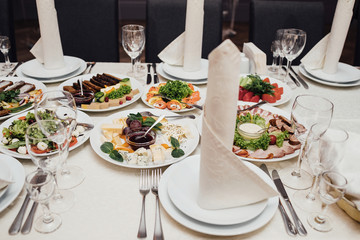 Fototapeta premium Served dishes to the table for holiday.