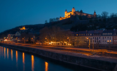 Marienberg Castle at night across the Main river in Wurzburg, Germany