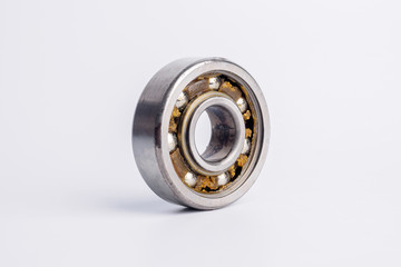 Used rusty metal ball bearing on white background.