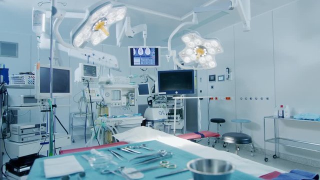 Establishing Shot of Technologically Advanced Operating Room with No People, Ready for Surgery. Real Modern Operating TheaterWith Working Equipment. Shot on RED EPIC-W 8K.