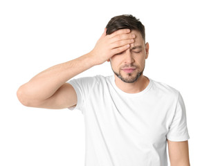 Man suffering from headache on white background