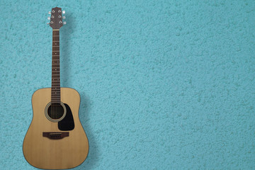 Obraz premium Guitar is a classic instrument on blue cement background
