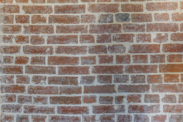 red brick wall texture grunge background with vignetted corners, may use to interior design