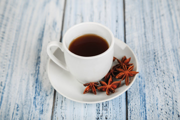 white coffe cup on light wooden background