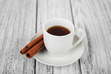 white coffe cup on light wooden background