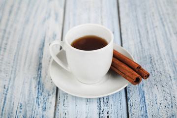 white coffe cup on light wooden background