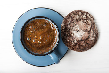 Blue coffee cup with chocolate cookie