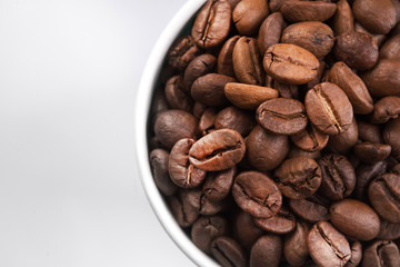 paper cup filled with coffee beans