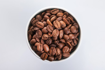 paper cup filled with coffee beans