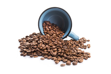 ceramic cup filled with roasted coffee beans