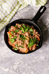 Bolognese sauce in frying pan. top view.