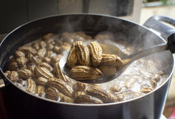 Boiled peanut,Peanuts boiled in chopsticks with boiling peanuts as a backdrop.