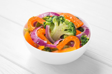 Fresh low-calorie salad with broccoli, pepper and onion