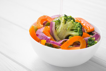 Fresh low-calorie salad with broccoli, pepper and onion